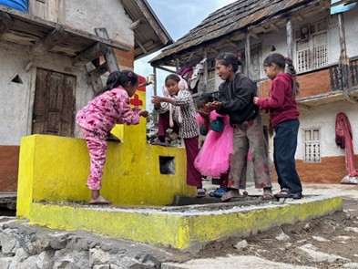 Figure 3: Children surrounding a water tab